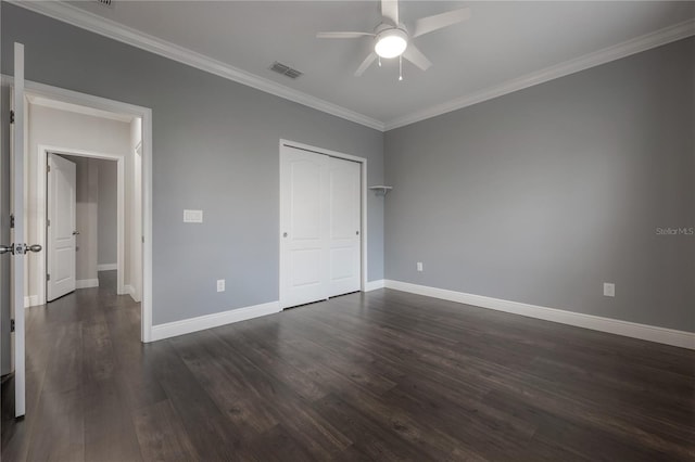 unfurnished bedroom with ceiling fan, dark hardwood / wood-style floors, and crown molding