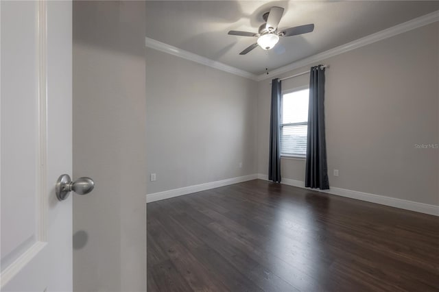 empty room featuring dark hardwood / wood-style floors, ceiling fan, and crown molding