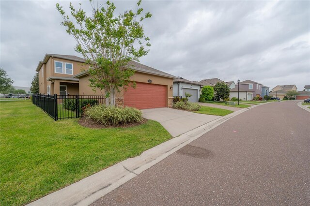 view of front of home with a garage and a front yard