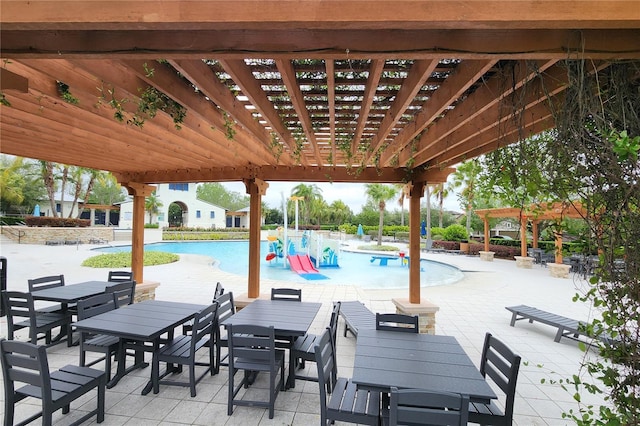 view of patio featuring a pergola and a community pool