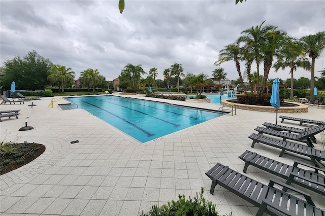 view of pool featuring a patio area