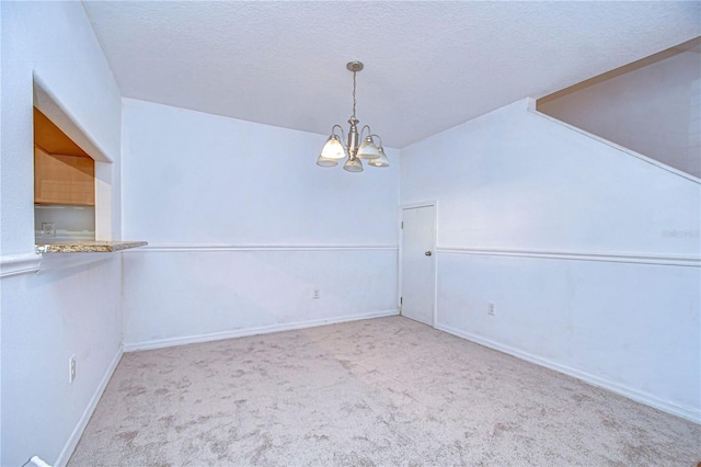 interior space with light colored carpet, a textured ceiling, and an inviting chandelier