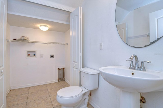 bathroom with tile patterned floors and toilet