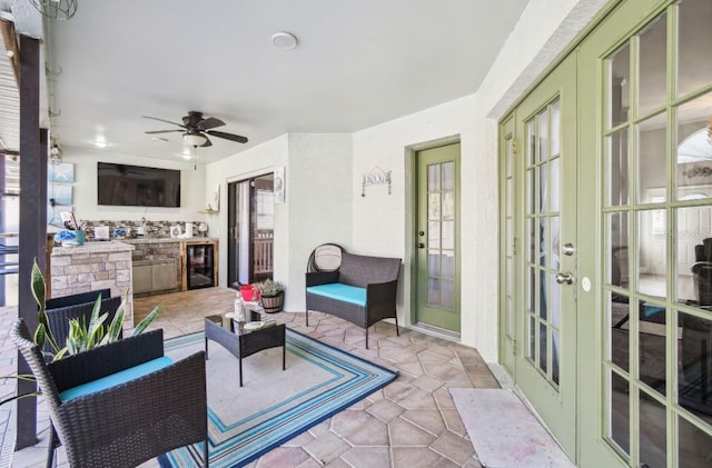 view of patio featuring ceiling fan, wine cooler, and french doors