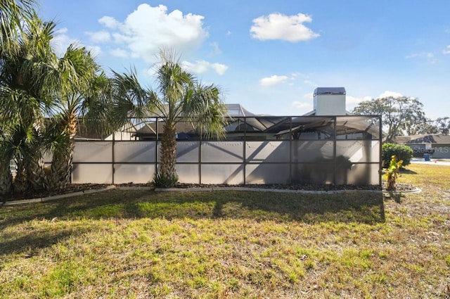 view of yard with a lanai