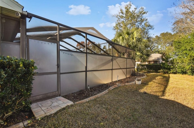 view of yard featuring glass enclosure