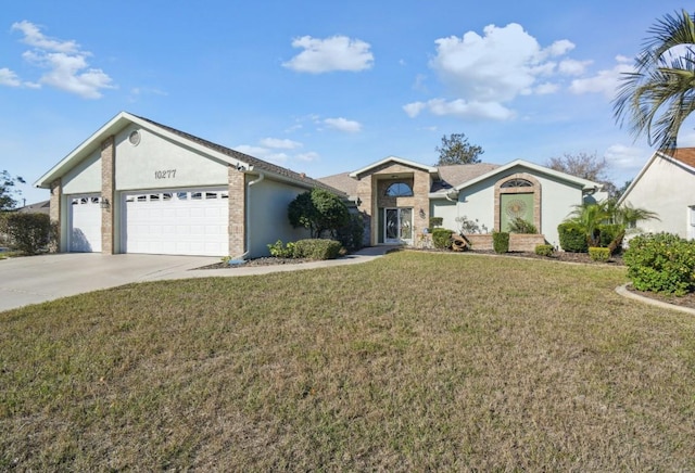 ranch-style house featuring a garage and a front lawn