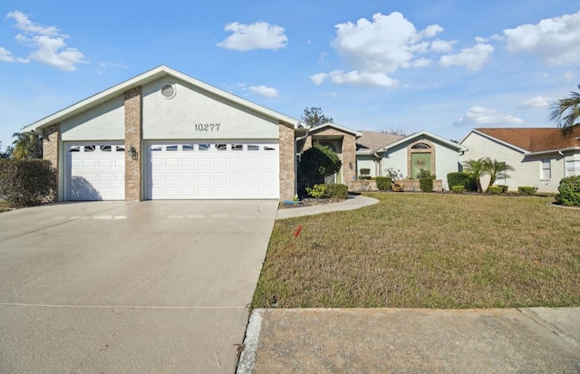 ranch-style house featuring a front yard and a garage