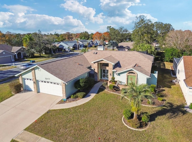 view of front of property featuring a garage and a front yard