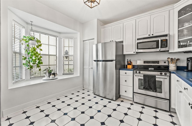 kitchen with white cabinetry and stainless steel appliances