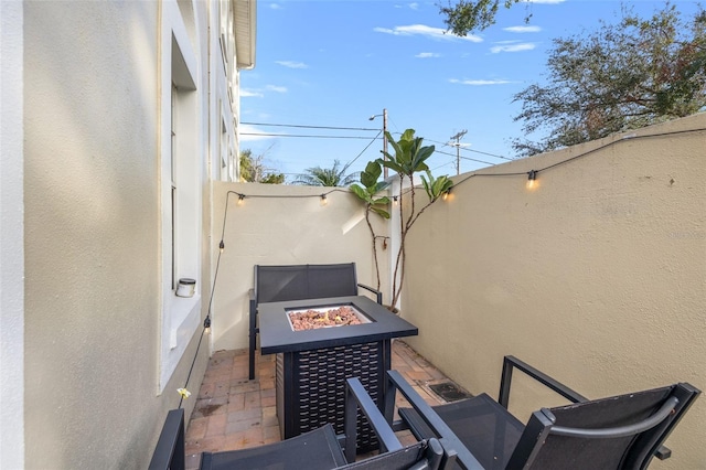 view of patio / terrace featuring an outdoor fire pit