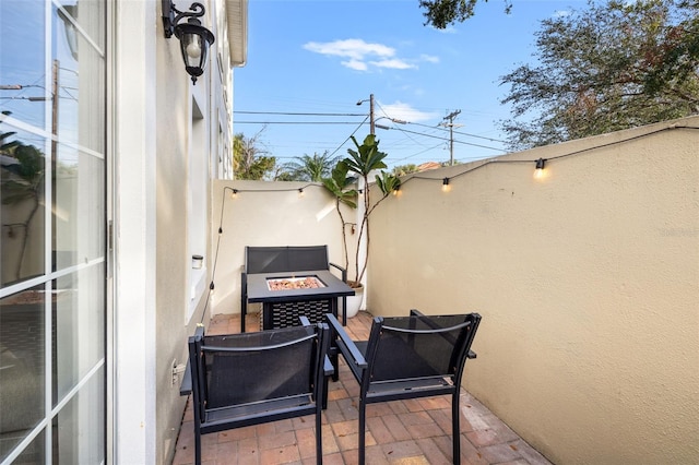 view of patio / terrace with an outdoor fire pit