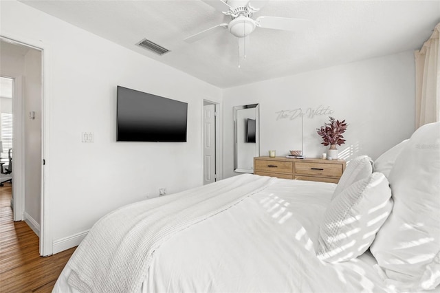 bedroom featuring ceiling fan and hardwood / wood-style floors