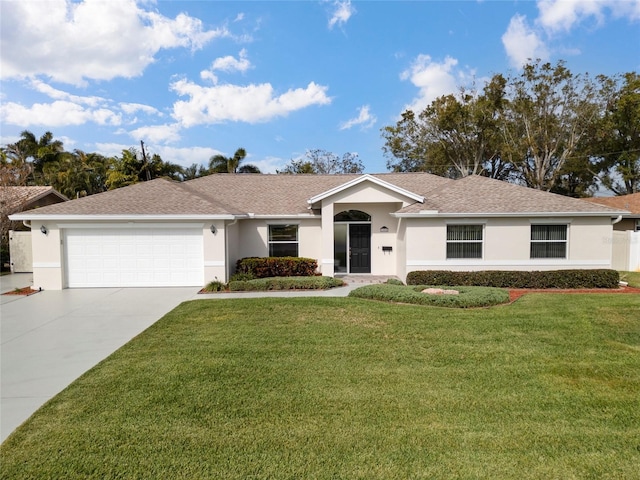 single story home featuring a garage and a front lawn