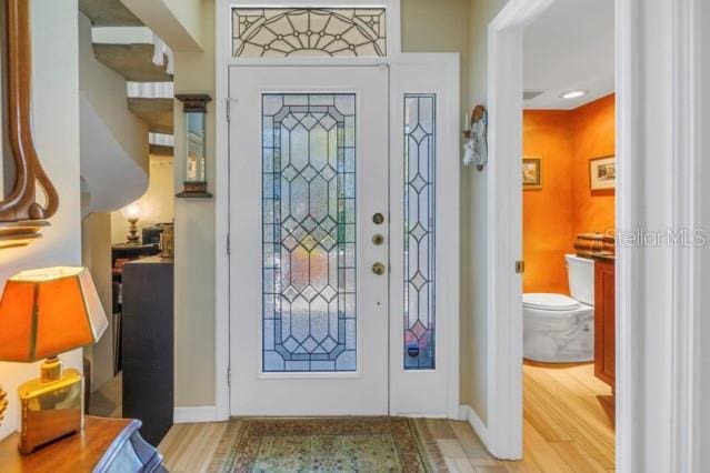 entrance foyer with light hardwood / wood-style flooring