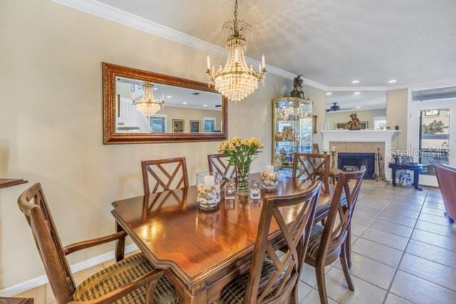 dining area featuring light tile patterned floors, an inviting chandelier, and ornamental molding