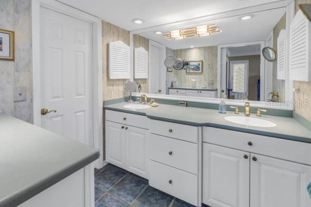 bathroom featuring a wealth of natural light and vanity