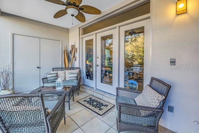 view of patio featuring ceiling fan