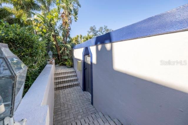 view of side of property featuring a balcony