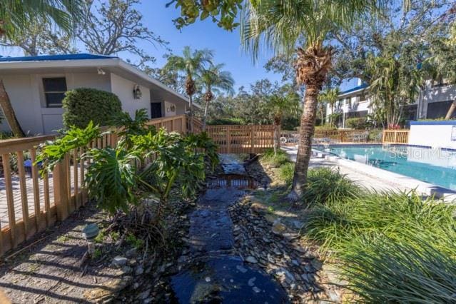 view of yard with a fenced in pool