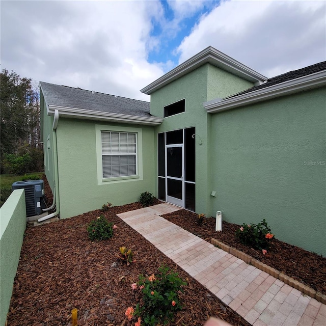 entrance to property with central AC unit