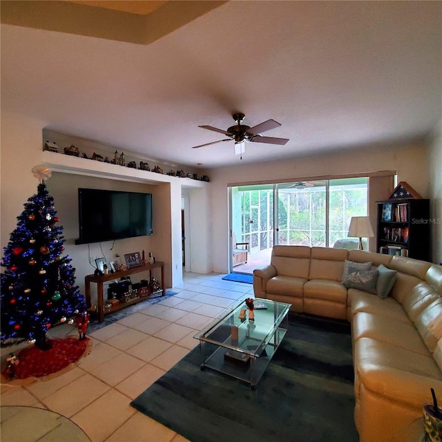 tiled living room featuring ceiling fan