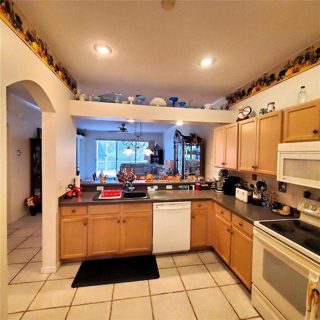 kitchen with ceiling fan, sink, kitchen peninsula, white appliances, and light tile patterned flooring