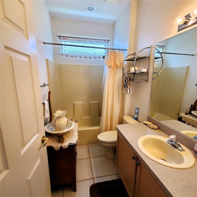 full bathroom featuring tile patterned floors, vanity, shower / bath combination with curtain, and toilet