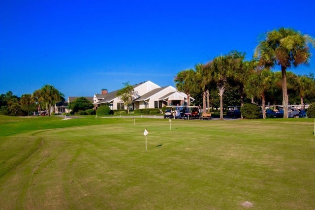 view of property's community with a yard