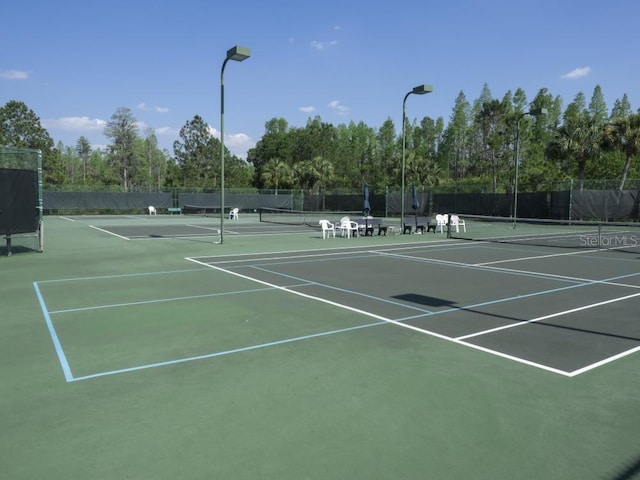 view of tennis court with basketball court