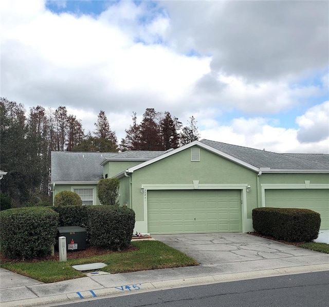 ranch-style home featuring a garage