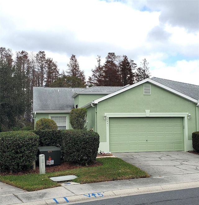 single story home featuring a garage