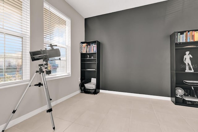 exercise area with light tile patterned floors