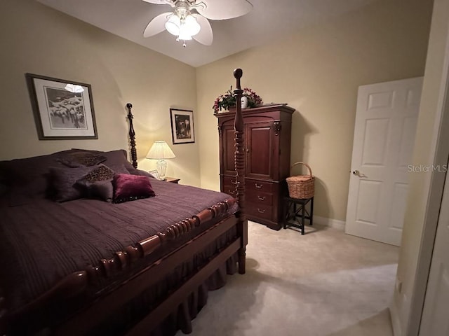 bedroom with baseboards, light carpet, and ceiling fan