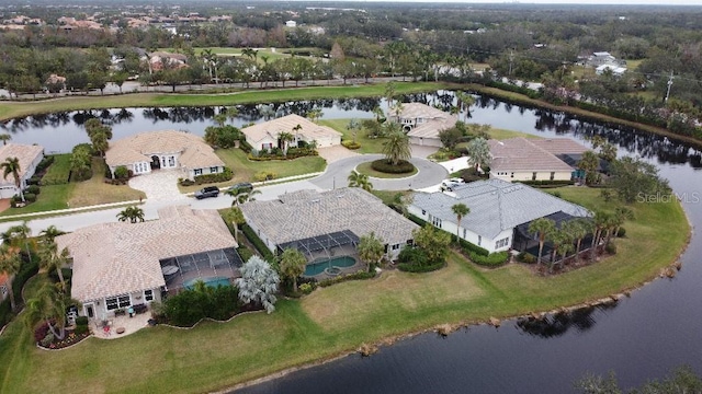 bird's eye view with a water view and a residential view