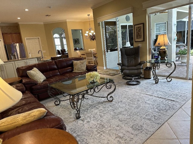 10626 Restoration Ter, Bradenton, FL 34212 - living room with a chandelier, ornamental molding, tile patterned flooring, and recessed lighting
