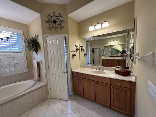 10626 Restoration Ter, Bradenton, FL 34212 - bathroom with a stall shower, tile patterned floors, vanity, a garden tub, and vaulted ceiling