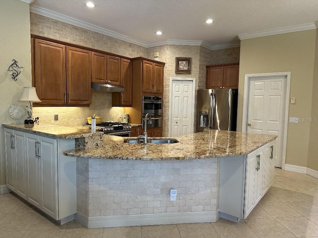 10626 Restoration Ter, Bradenton, FL 34212 - kitchen featuring appliances with stainless steel finishes, a sink, a peninsula, light stone counters, and light tile patterned floors