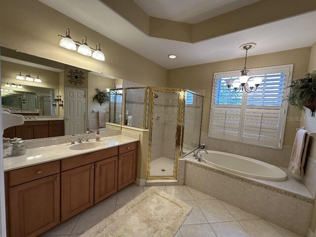 10626 Restoration Ter, Bradenton, FL 34212 - bathroom with tile patterned flooring, a bath, a shower stall, a chandelier, and vanity