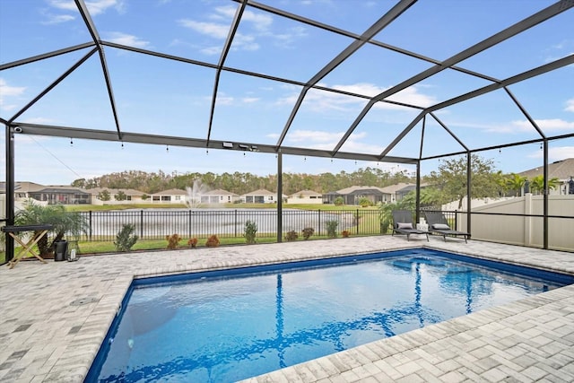 view of pool with a lanai and a patio