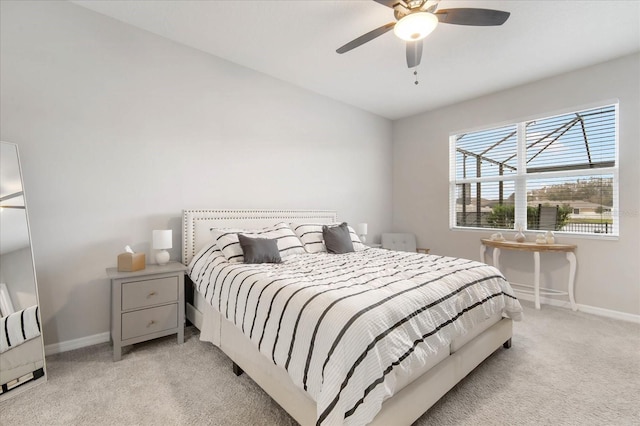 bedroom featuring ceiling fan and light colored carpet