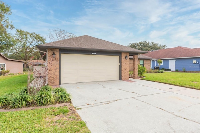 ranch-style house featuring a front yard and a garage