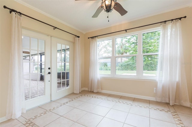 doorway to outside with ceiling fan, light tile patterned flooring, crown molding, and french doors