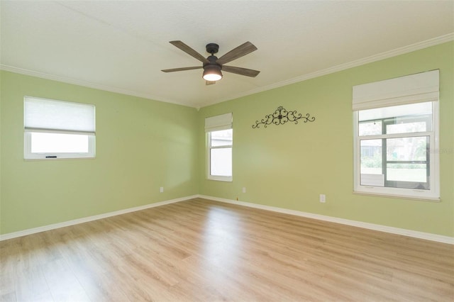 unfurnished room with light hardwood / wood-style floors, crown molding, ceiling fan, and a healthy amount of sunlight