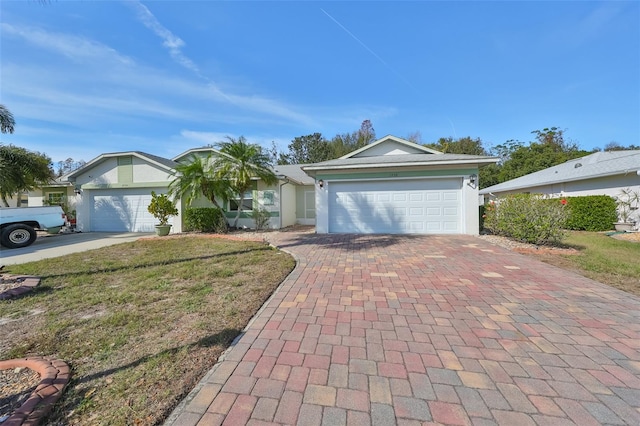 single story home with a front yard and a garage