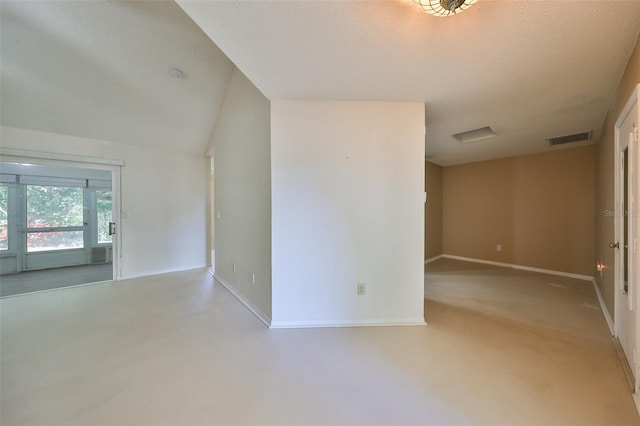 spare room with a textured ceiling