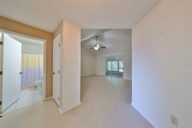 hallway featuring lofted ceiling