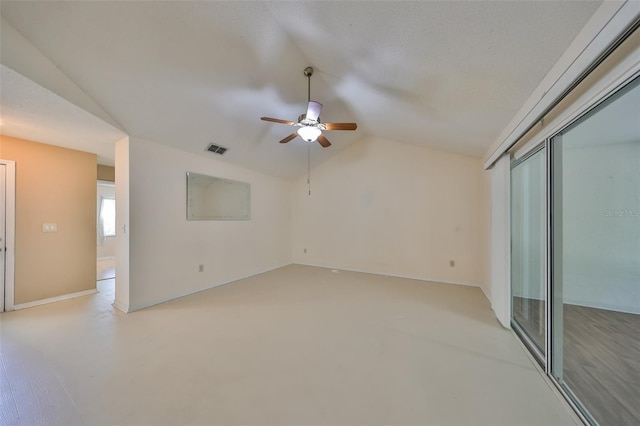 empty room with ceiling fan and lofted ceiling