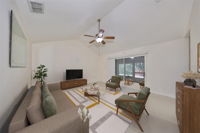 living room featuring carpet floors, ceiling fan, and lofted ceiling