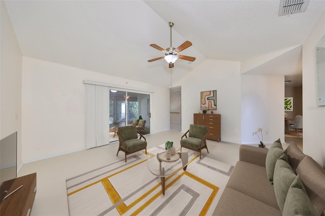 living room featuring ceiling fan, a textured ceiling, and vaulted ceiling